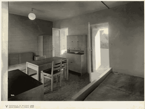 Image for V Triennale - Mostra dell'abitazione - Gruppo di elementi di case popolari di Enrico Griffini e Piero Bottoni - Stanza di soggiorno-letto di un alloggio tipo di 25,50 mq.